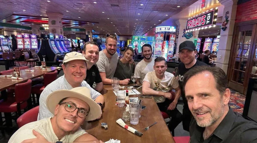 Nathan Buzza with the Illuminati Magic team and partners over dinner at a Las Vegas casino restaurant.